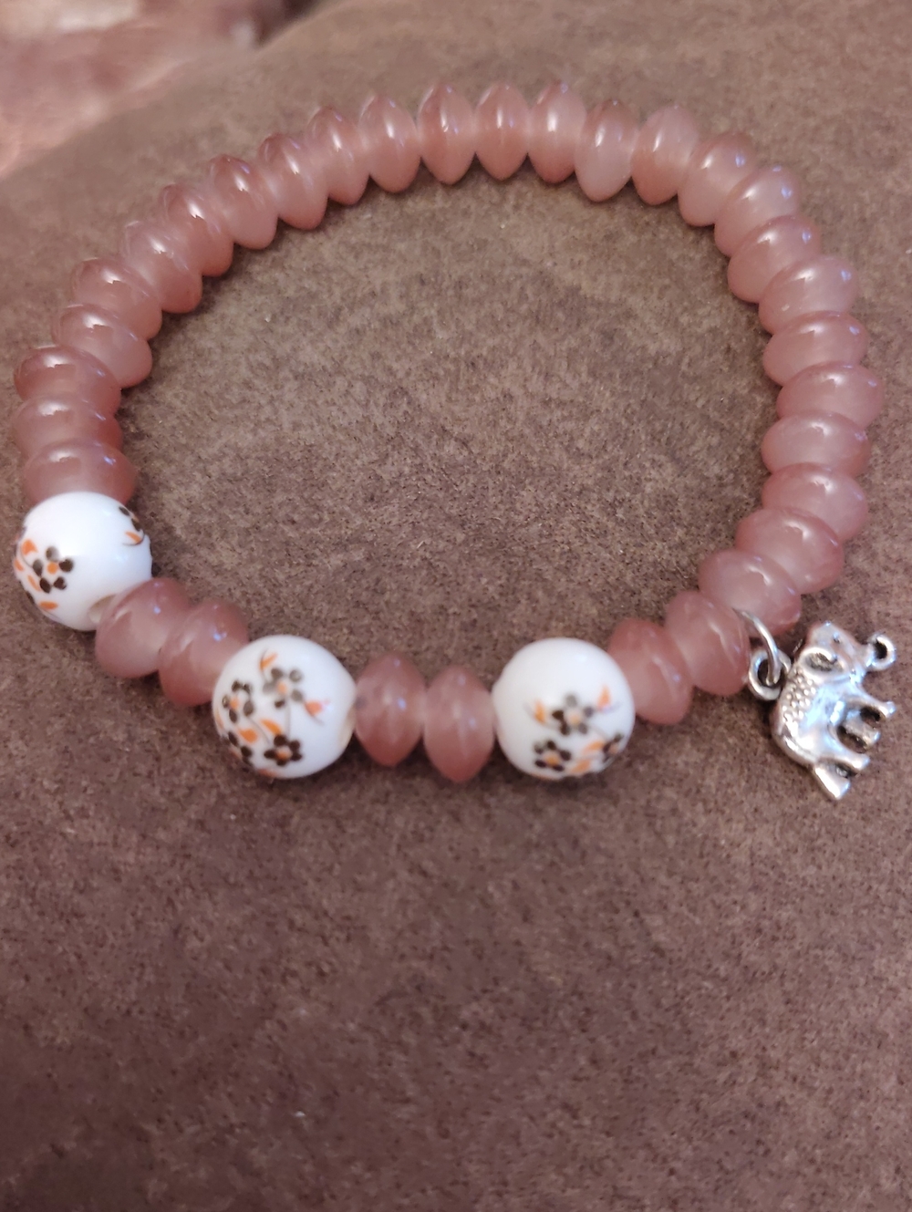 Pink Beaded Stretch Bracelet with Floral Accent Beads and Elephant Charm